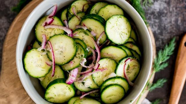 Old-fashioned cucumbers and onions in vinegar